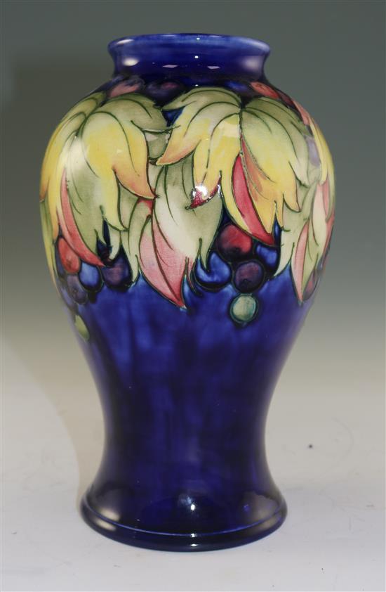 A Moorcroft leaf and berry pattern baluster vase, mid 20th century, 23.5cm (9.25in.)